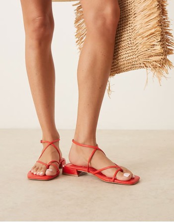 Flaunt barely there strappy flat sandals in red