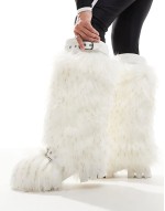 Tommie fluffy knee boots in white