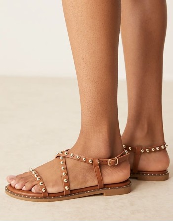 studded flat sandals in tan